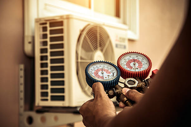 Professional Heat Pump Repair technician working in Brookville, NY